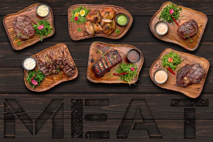 meat-dishes-chicken-ribs-steak-wooden-background-with-inscription-meat_210632-2014